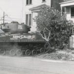 A-tank-prepares-to-attack-first-house-1-e1743531868964-1536×732