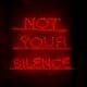 Red neon artwork reading Not Your Silence