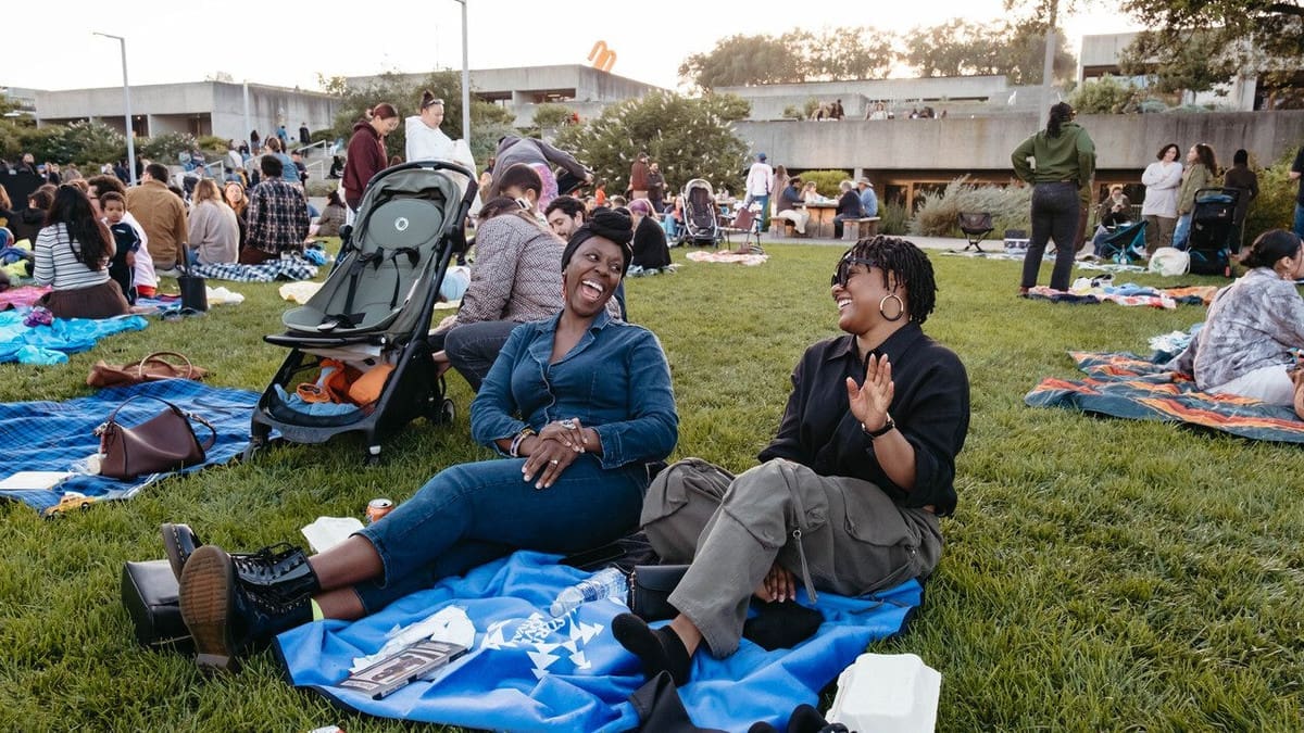Visitors relaxing on the OMCA lawn