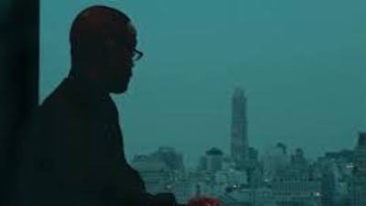 Kenny Washington in silhouette overlooking the San Francisco skyline