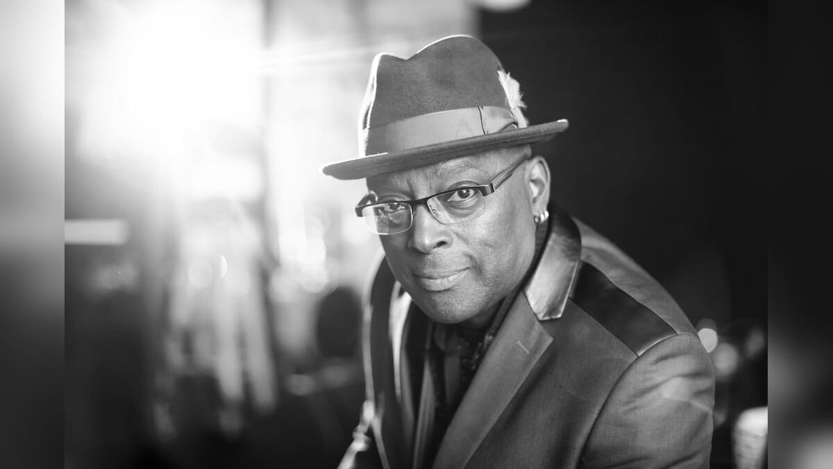 Charles Unger wearing glasses and a hat