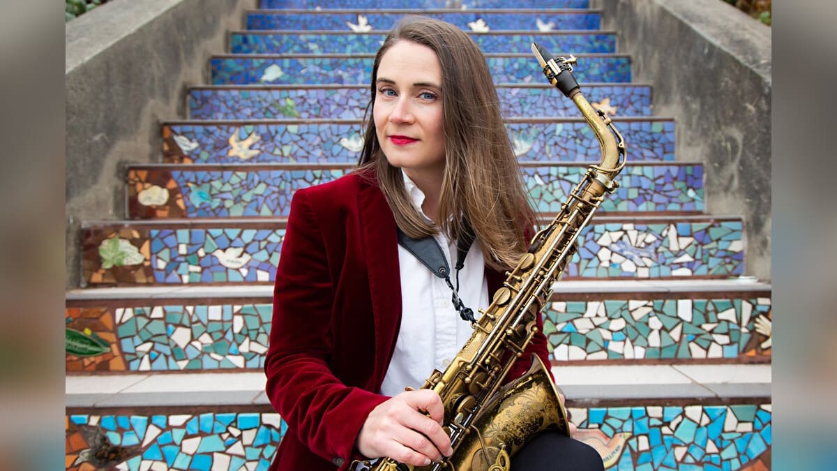 Beth Schenck holding a saxophone