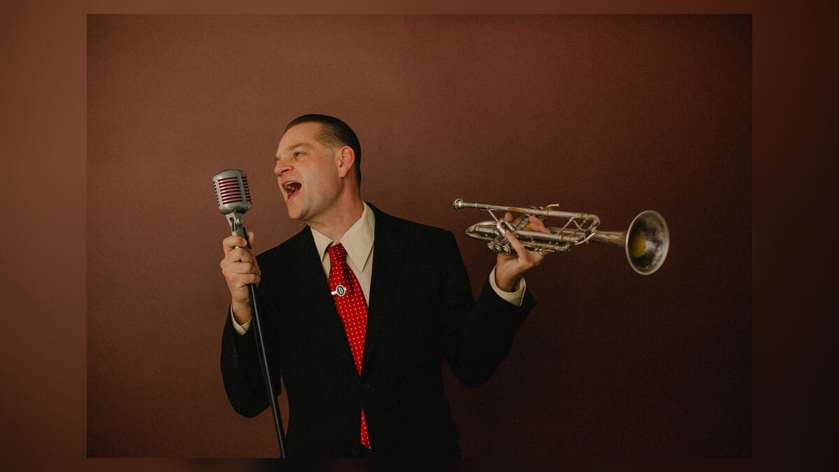 Rob Dehlinger holding a trumpet