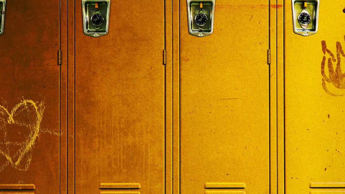 Yellow school lockers decorated with a red heart and a black smiley face.