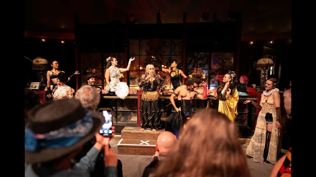 Performers and audience inside The Soiled Dove’s Tortona Big Top.