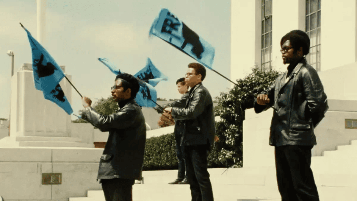Historical photograph of Black Panther Party members holding flags, used in the official 60th-anniversary artwork.