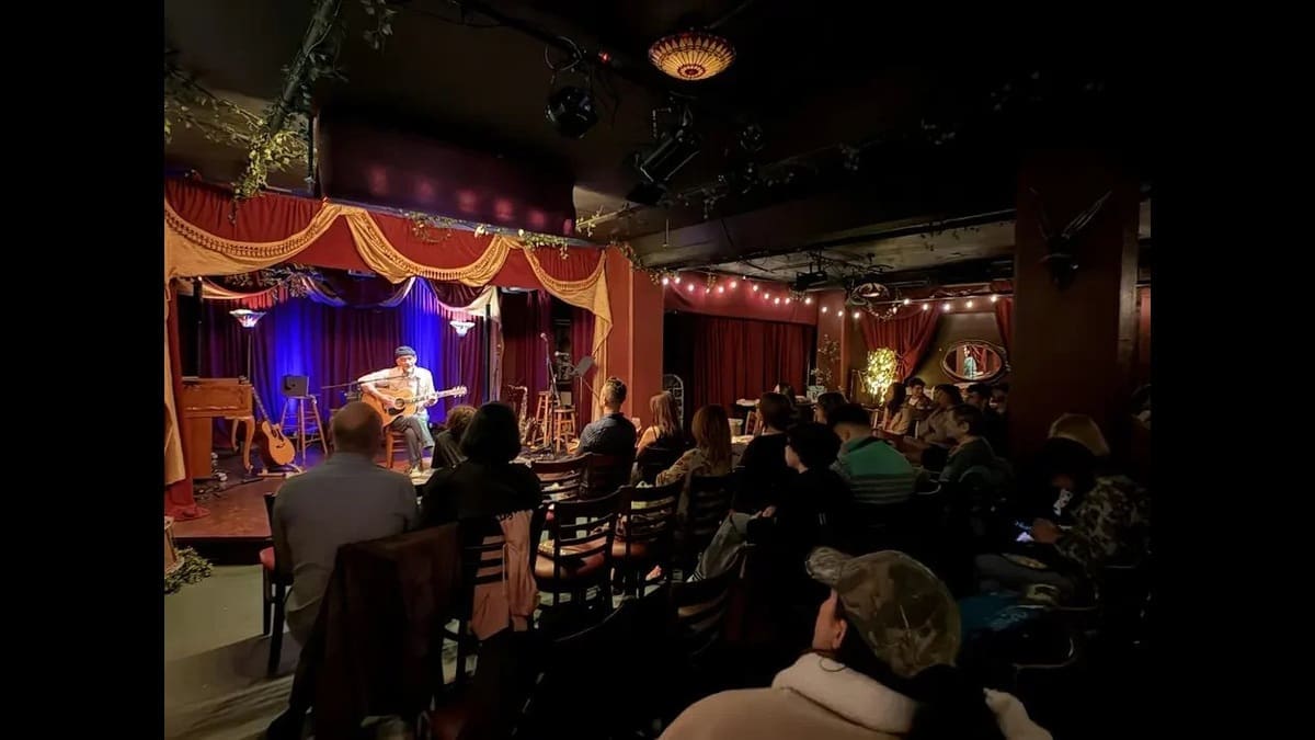 Audience seated around the stage at The Lost Church in San Francisco